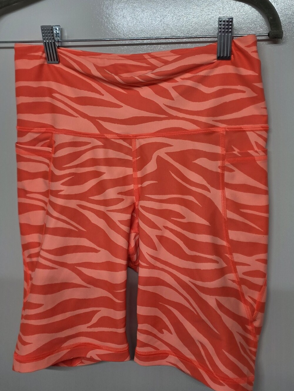 Old Navy neon orange and coral zebra print biker shorts with side pockets